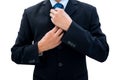 Businessman rearrange his neck tie