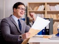 Businessman receiving letter envelope in office