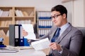 The businessman receiving letter envelope in office