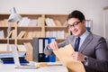 The businessman receiving letter in the office