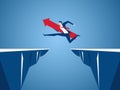 Businessman with red arrow sign jump through the gap between hill. Running and jump over cliffs. Business risk and success concept