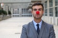 Businessman with a red clown nose Royalty Free Stock Photo