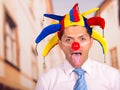 Businessman with a red clown nose Royalty Free Stock Photo