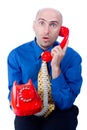 Businessman on a red phone Royalty Free Stock Photo