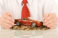 Businessman with red toy car Royalty Free Stock Photo