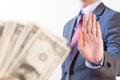 Businessman refuses to receive money - no bribery and corruption Royalty Free Stock Photo