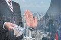 Businessman refusing money with modern city background