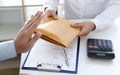 Businessman refusing to receive the money in a brown envelope to sign a business contract Royalty Free Stock Photo