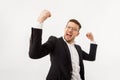 Businessman rejoicing for his success. A jubilant businessman white background.