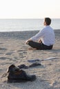 Businessman relaxing on a beach Royalty Free Stock Photo