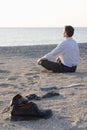 Businessman relaxing on a beach