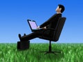 Businessman relaxing in grass