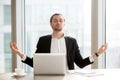 Businessman relieves work stress with meditation Royalty Free Stock Photo