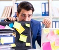 Businessman with reminder notes in multitasking concept