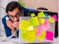 Businessman with reminder notes in multitasking concept