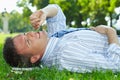 Businessman resting outdoor lying on back at park Royalty Free Stock Photo