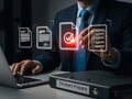 Businessman reviewing digital document compliance with checkmark icon on virtual interface in office Royalty Free Stock Photo