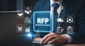 Businessman reviews Request for Proposal RFP with icons Royalty Free Stock Photo