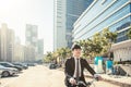 Businessman riding bicycle to work on urban street at morning Royalty Free Stock Photo