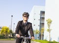 businessman riding a bicycle to workplace for protecting environment