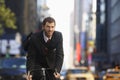 Businessman Riding Bicycle On Urban Street Royalty Free Stock Photo