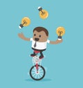 Businessman riding bike one wheel play acrobatic bulbs Concept Royalty Free Stock Photo