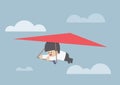 Businessman riding a hang glider