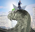 Businessman riding paper boat in dollar sea Royalty Free Stock Photo