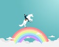 Businessman riding a unicorn on rianbow Royalty Free Stock Photo