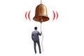 Businessman ringing the bell in case of danger