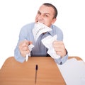 Businessman ripping apart contract with his teeth Royalty Free Stock Photo