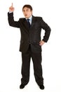 Businessman with rised finger. Idea gesture