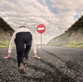 Businessman on a road ready to run Royalty Free Stock Photo