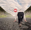 Businessman on a road ready to run with No Entry Traffic Royalty Free Stock Photo