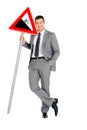 Businessman with road sign