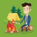 Businessman roasting marshmallow over campfire.