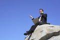 Businessman on a rock