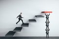 Businessman runing on stairs to success on wall