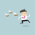 Businessman running away from dangerous insects Royalty Free Stock Photo