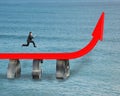 Businessman running on growing red arrow Royalty Free Stock Photo