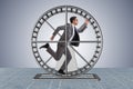 The businessman running on hamster wheel Royalty Free Stock Photo