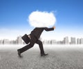 Businessman running with head in the clouds Royalty Free Stock Photo