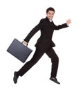 Businessman running with his briefcase Royalty Free Stock Photo