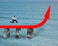 Businessman running on red trend arrow bridge Royalty Free Stock Photo