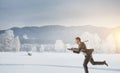 Businessman running in winter countryside Royalty Free Stock Photo