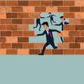 Businessman running though the breaked brick wall