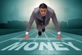 The businessman running towards money on track Royalty Free Stock Photo