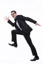 Businessman runs in black suit on white. Royalty Free Stock Photo