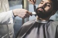 BusinessmanÃ¯Â¿Â½s beard being trimmed Royalty Free Stock Photo