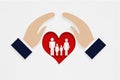 hand cover red heart paper cut with family icon inside on grunge gray background for wellness and wellbeing, world